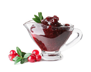 Gravy boat with tasty lingonberry jam and fresh berries on white background