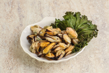 Tasty marinated mussels in the bowl