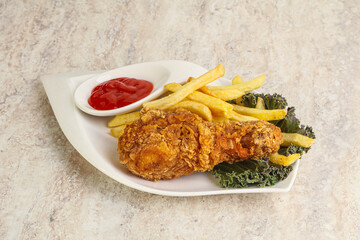 Crispy chicken leg with fry potato