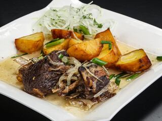 Grilled beef with potato and onion