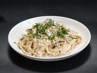 Spaghetti with cream sauce and herbs