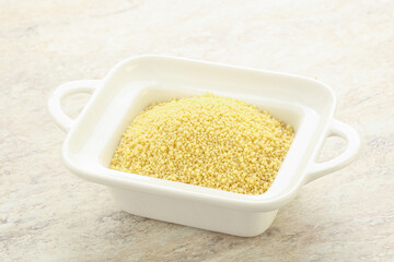 Raw couscous in the bowl