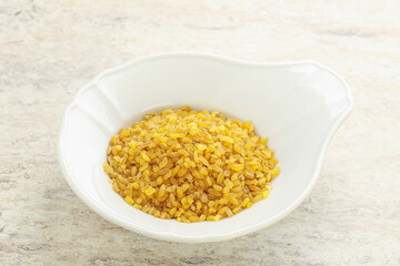 Raw bulgur in the bowl