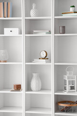 Shelf unit with books and stylish decor