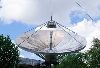 satellite dish transmits signals to the sky