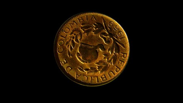 Rotating obverse of Columbia coin, 1 centavo 1969. Isolated in black background. 