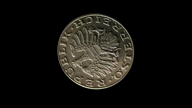 Rotating obverse of Austria coin 10 schilling minted from 1974 to 2001 with inscription REPUBLIC OF AUSTRIA. Isolated in black background.
