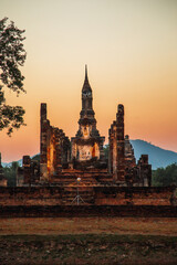 Sunset at Wat Mahathat buddha and temple in Sukhothai Historical Park