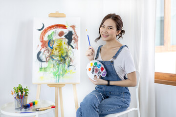 Female artist painting on canvas, Artist studio interior, Draw with watercolor, Drawing supplies ,...