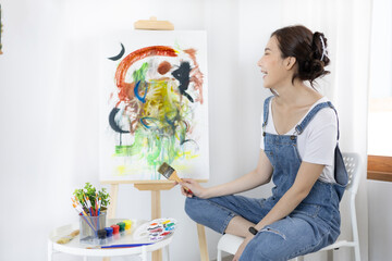 Female artist painting on canvas, Artist studio interior, Draw with watercolor, Drawing supplies , Painting and creativity, Use a brush to draw a pattern by stripes, Artwork, Using Paint Brush.