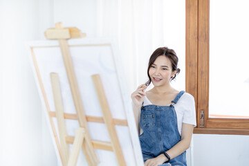 Female artist painting on canvas, Artist studio interior, Draw with watercolor, Drawing supplies ,...