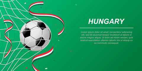 Soccer background with flying ribbons in colors of the flag of Hungary