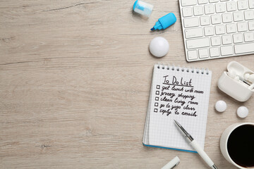 Flat lay composition with to do list on wooden table, space for text