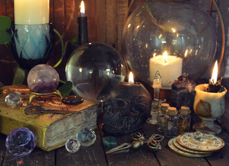 Wicca, esoteric and occult still life with vintage magic objects on witch table altar for mystic...