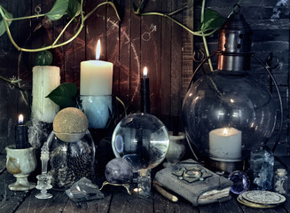 Wicca, esoteric and occult still life with vintage magic objects on witch table altar for mystic...