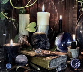 Wicca, esoteric and occult still life with vintage magic objects on witch table altar for mystic...