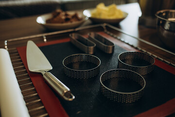 Kitchen utensils on the graphite background.