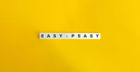 Fotobehang Easy-peasy Slang on Letter Tiles on Yellow Background. Minimal Aesthetics. © photoopus