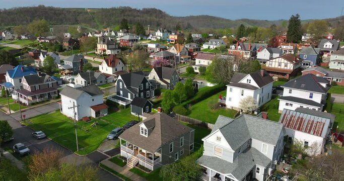 Coal mining town. Rising aerial reveals mine in distance. Housing in small neighborhood community in rural Appalachian Mountains.