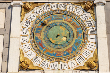 Fototapeta na wymiar Brescia downtown. Clock and bell tower in Renaissance style, 1540-1550, in Loggia town square (Piazza della Loggia). Lombardy, Italy, Europe. Astronomical clock with the constellations of the zodiac.