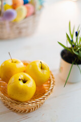 Yellow apples on white wooden background