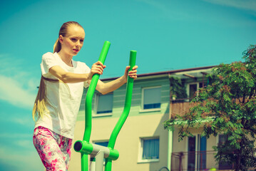 Girl exercise at outdoor gym area