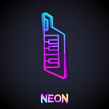 Glowing neon line Keytar icon isolated on black background. Musical instrument. Vector