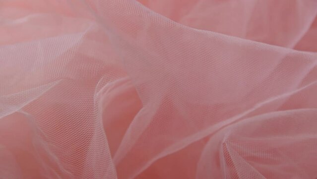 Pink tulle material background, pastel colors, romantic and delicate drapery
