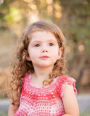 Little charming girl with curly hair