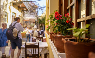 Flower pot on windowsill in the street.
