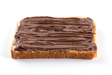 Slice of toast bread with chocolate hazelnut paste isolated on white background. Selective focus.
