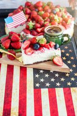 traditional strawberry cheesecake and  american patriotic breakfast table,  usa flag	
