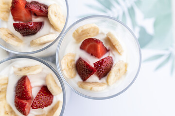 Granola with yogurt, strawberry and banana for a healthy breakfast.
