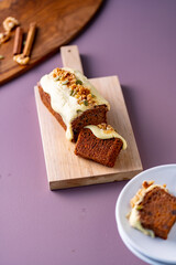 Sliced carrot cake on cutting board.
Delicious carrot cake.