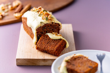 Sliced carrot cake on cutting board.
Delicious carrot cake.