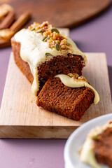 Sliced carrot cake on cutting board.
Delicious carrot cake.