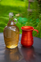 Bottle of white wine and metal jug