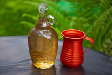 Bottle of white wine and metal jug