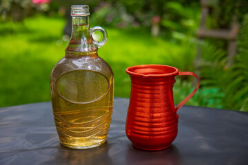 Bottle of white wine and metal jug