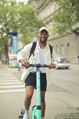 young man in a city witha  scooter