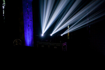 lighting in a nightclub. spotlights in a nightclub. Geometrical white concert lights on bright...