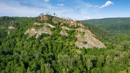 Fototapeta na wymiar Ural Mountains, Bashkiria, Kyzyltash rocks and Kalim-Uskan rock. Aerial view.