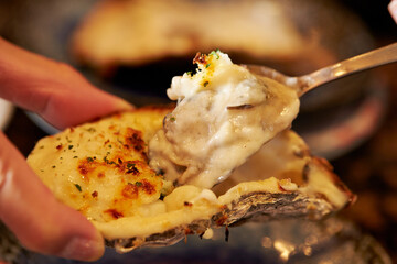Grilled Butter Cheese Oysters on a Plate