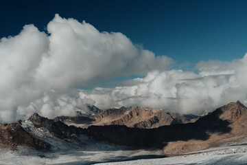 Landscape. Mountains in the clouds at high altitude. Film processing.