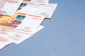 Russian rubles banknotes on grey background with copy space. Payment in rubles concept. Selective...