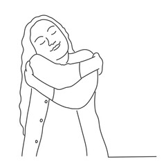 Young girl with long hair hugging herself.