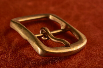 Buckle in solid brass with traces of patina.