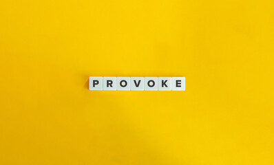 Provoke Word on Letter Tiles on Yellow Background. Minimal Aesthetics.