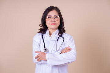 Image of middle aged Asian female doctor on background