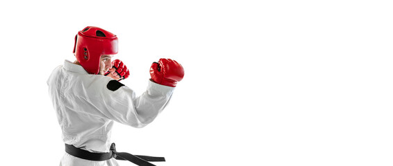 Flyer with portrait of young sportive man wearing white dobok, helmet and gloves practicing isolated over white background. Concept of sport, workout, health.